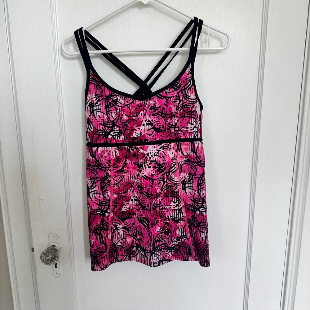 Champion, size medium exercise top. Pink and black print with loose bodice.